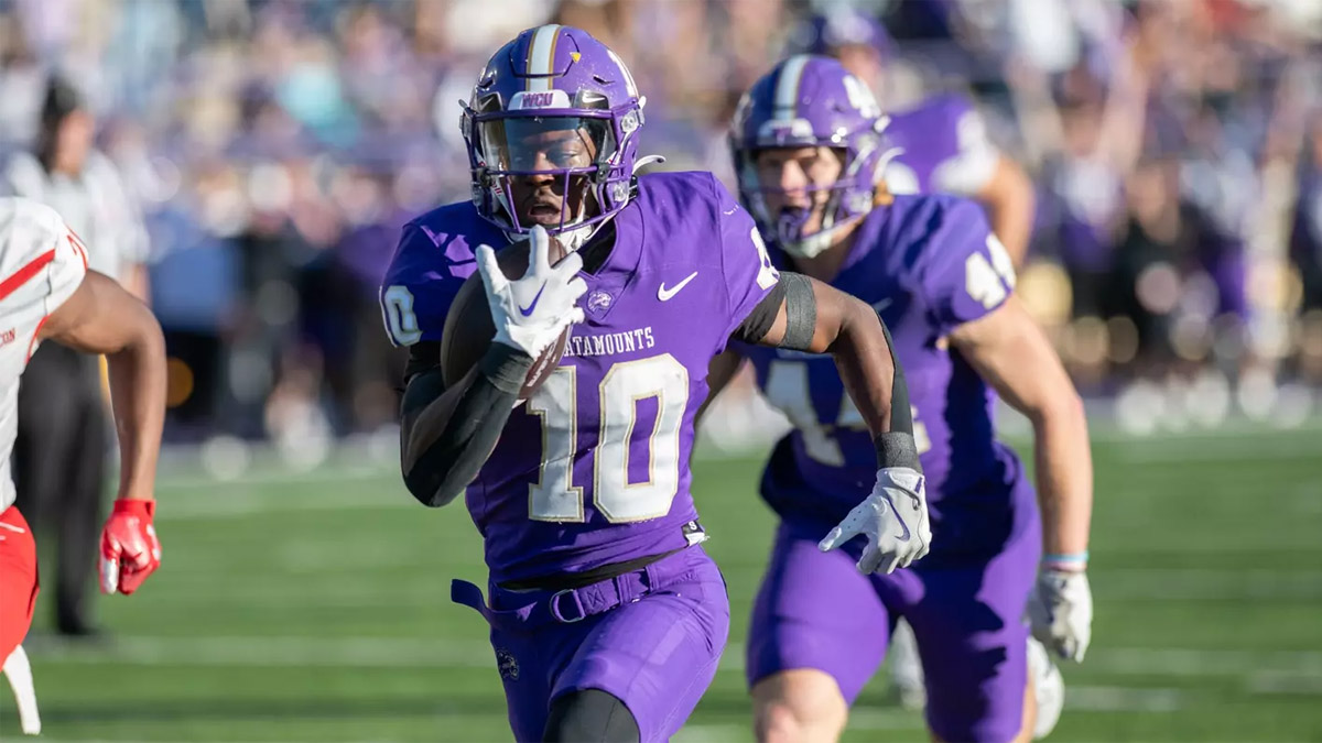 Western Carolina wide receiver Patrick Boyd Jr. looks for yardage after making a catch in a 2024 FCS football game.