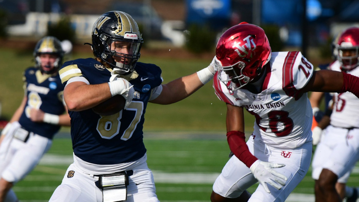 Wingate football tight end Matt Flanders looks for yardage against Virginia Union in the 2024 D2 football playoffs