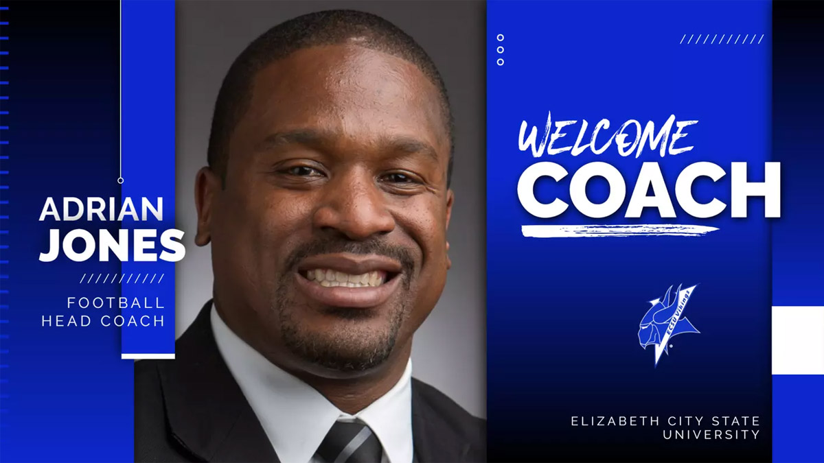 Adrian Jones, new head football coach of Elizabeth City State University, smiling in professional attire.