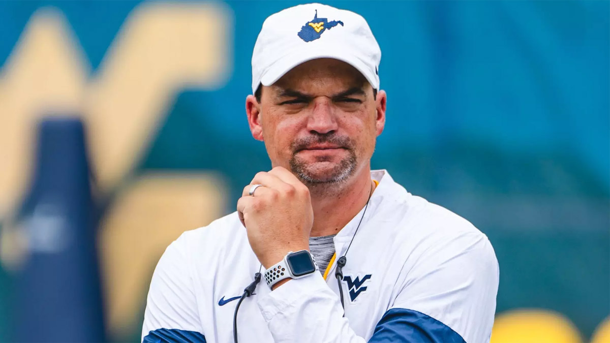 Neal Brown, former West Virginia coach, emerges in coaching search at Appalachian State and Charlotte.