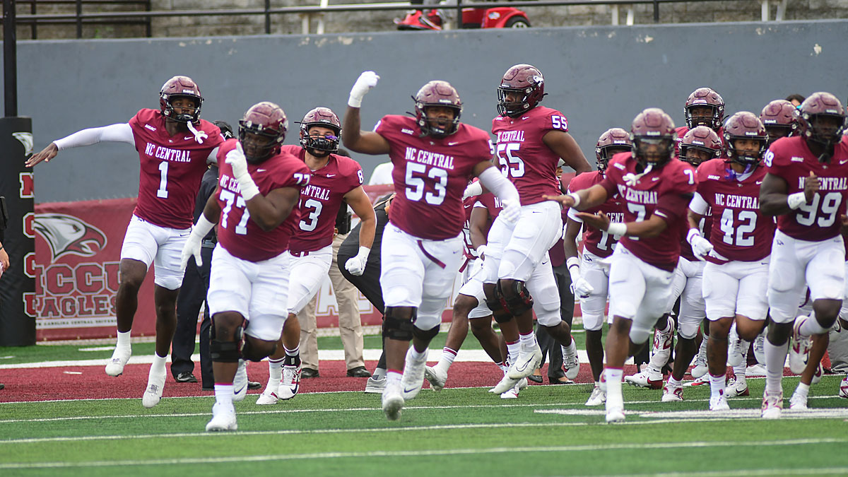North Carolina Central football players run onto the field before a 2024 game against Elon