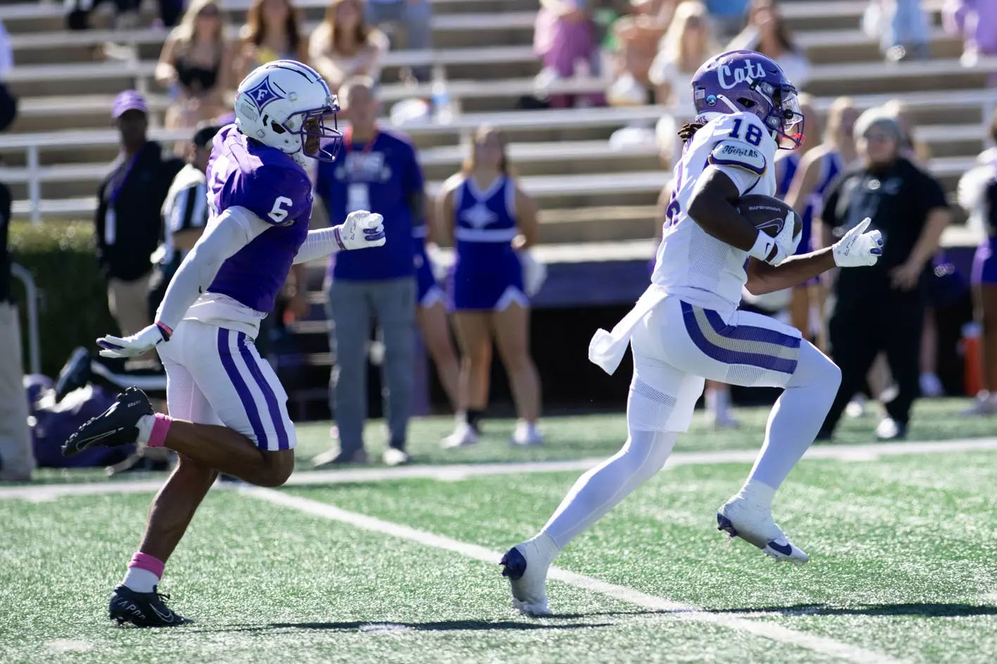 Western Carolina wide receiver Isaiah Johnson runs away from the Furman defense in a 2024 game.