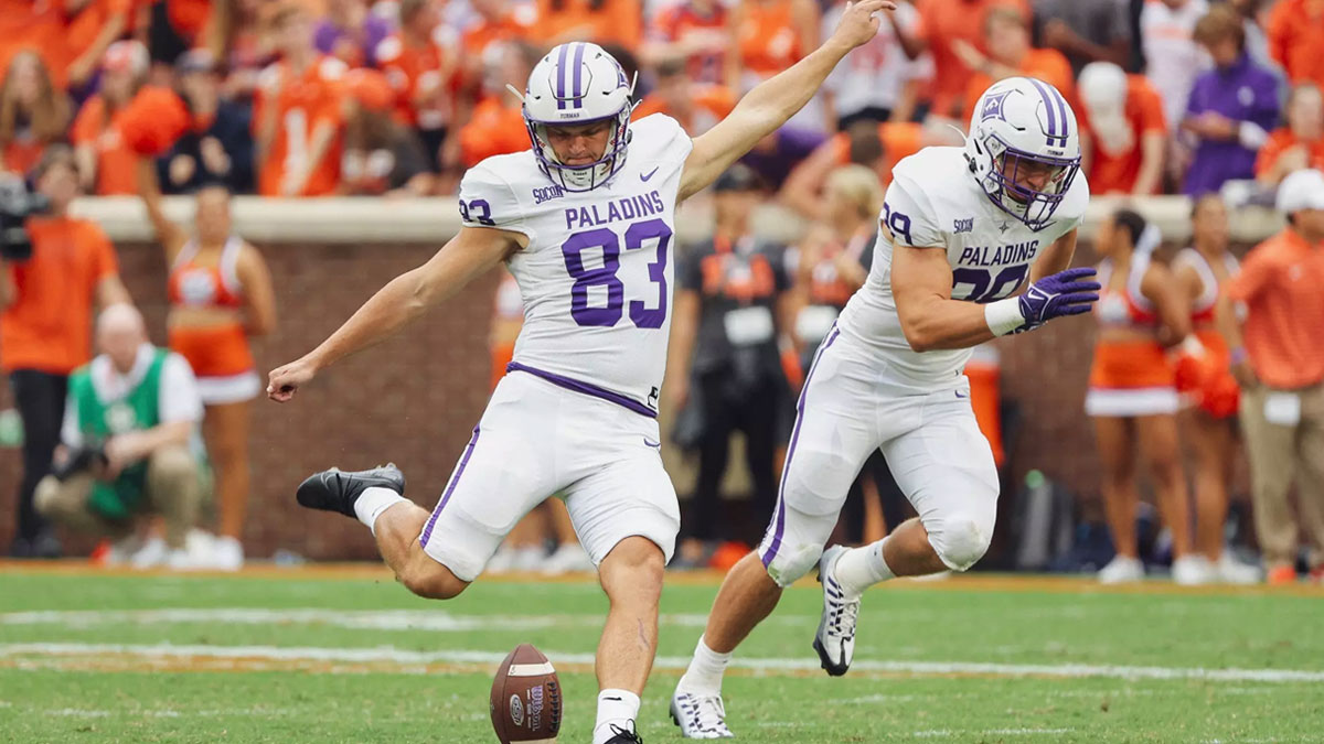 Furman's Ian Williams kicks off in a game at Clemson