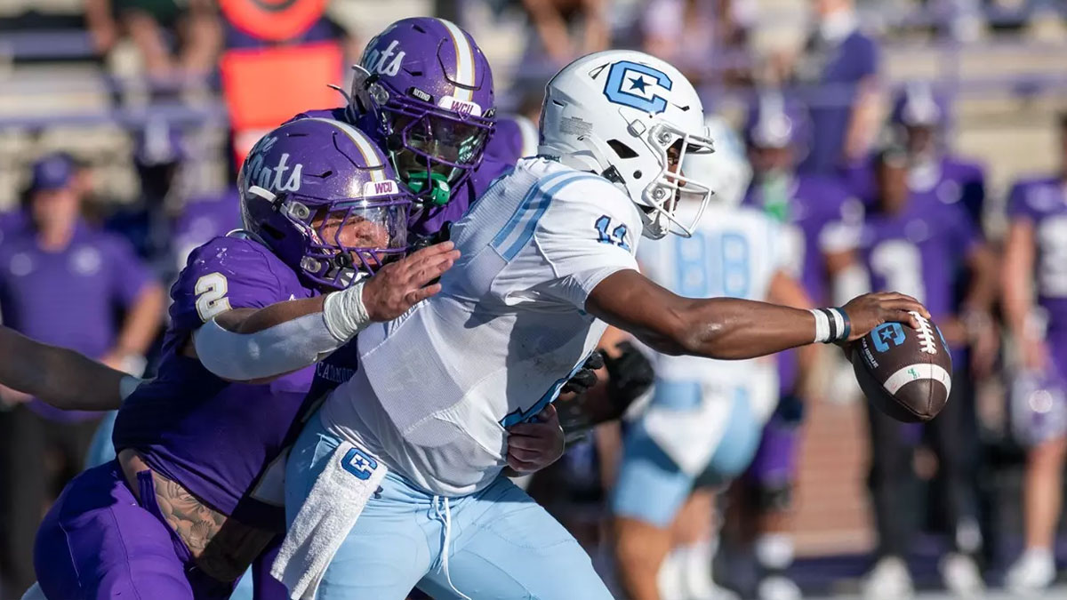 WCU's Micah Nelson tackles The Citadel quarterback in a 2024 football game.