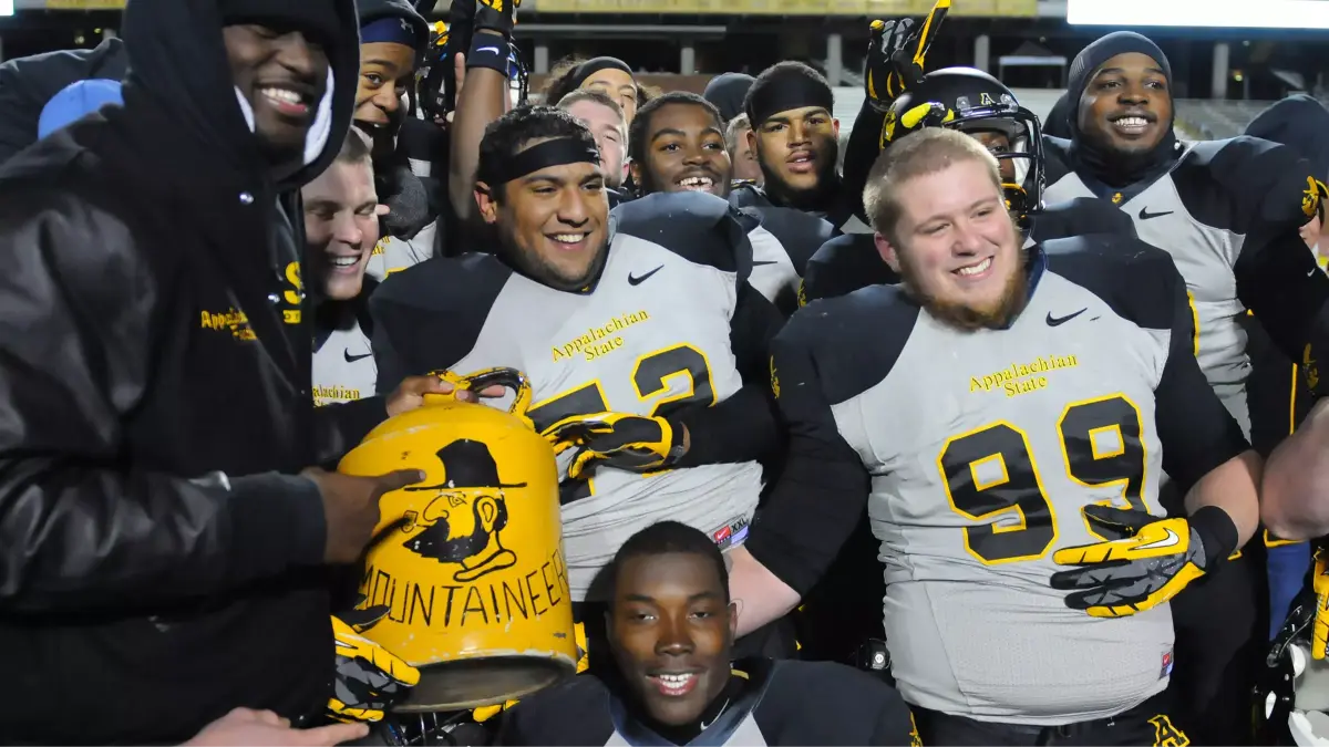 Appalachian State celebrates after winning the most recent Battle for the Old Mountain Jug in 2013.