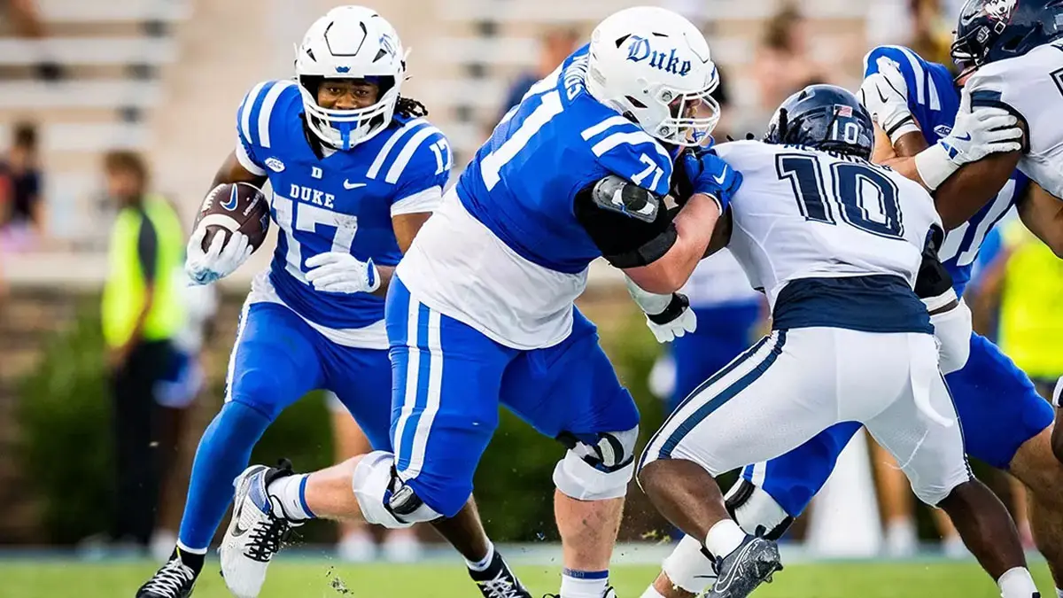 Duke football's Star Thomas - NCFootballNews Duke's Star Thomas rushes for yardage against UConn in the Blue Devils' 2024 victory.