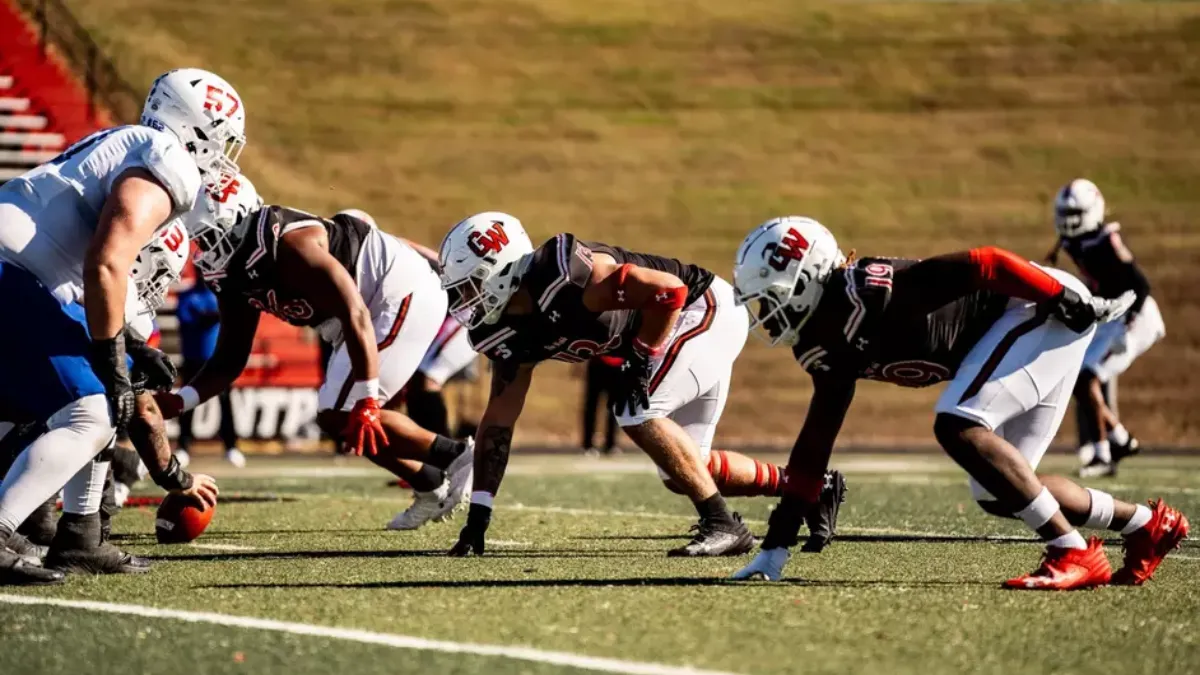 Gardner-Webb football players line up on defense in a 2024 game.