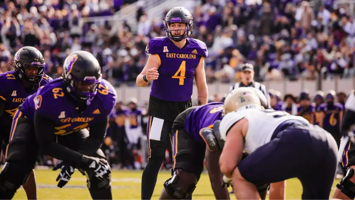 ECU quarterback Katin Houser looks over the line of scrimmage during a 2024 Pirates game.