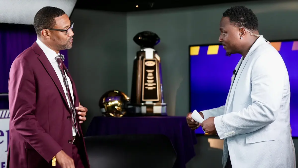 North Carolina Central coach Trei Oliver talks with LeSean McCoy during MEAC media day in Baltimore.