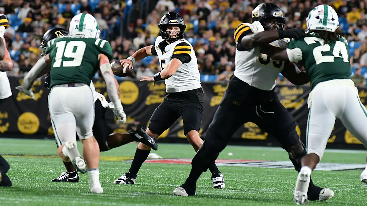 Appalachian State quarterback AJ Swann looks downfield against Charlotte in the Duke's Mayo Classic