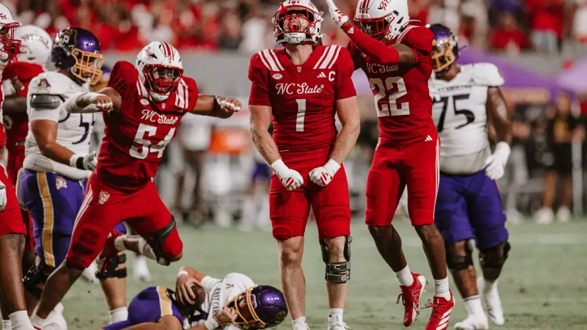 NC State players, led by Caden Fordham, celebrate a big defensive play against East Carolina.