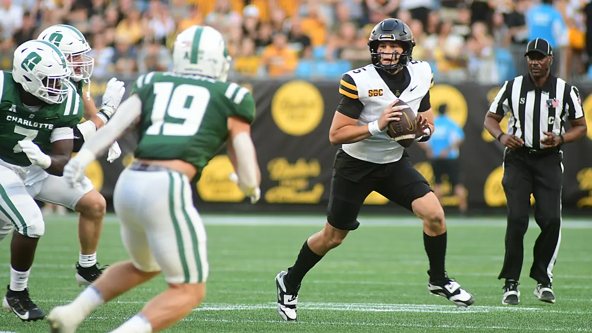 App State quarterback AJ Swann rolls out against Charlotte in the Mountaineers' season opener on Aug. 28, 2025
