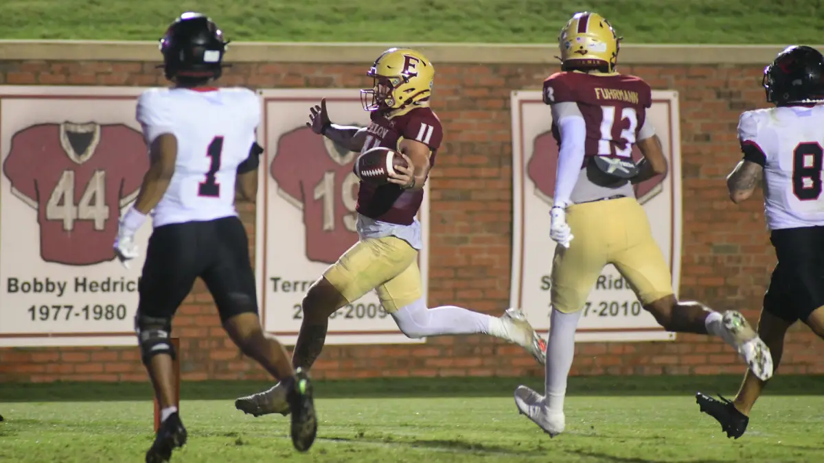 Elon quarterback scrambles toward the end zone against Davidson on Sept. 6, 2025