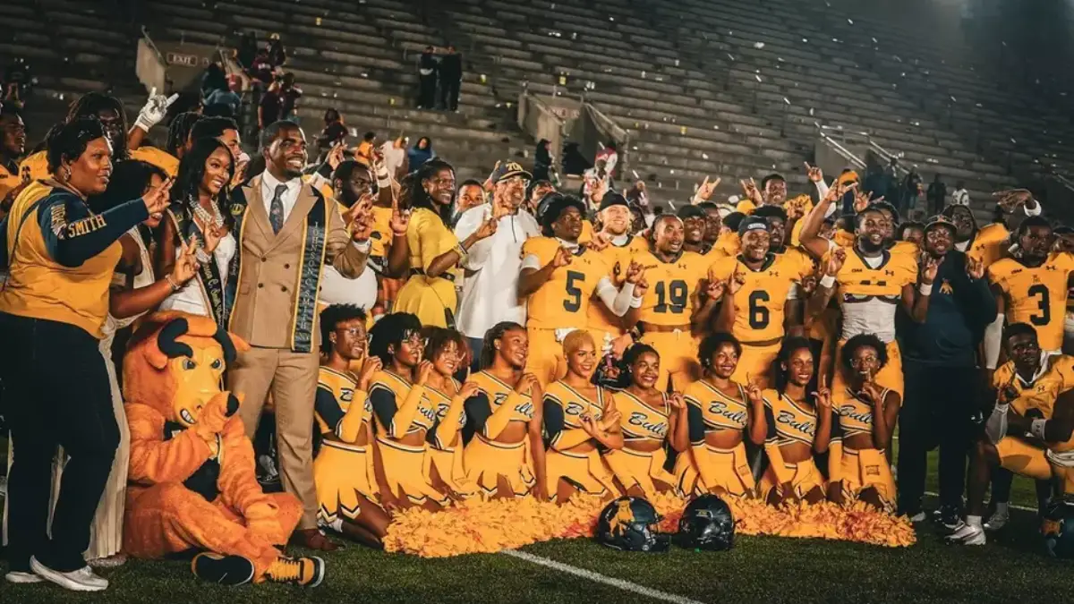 Johnson C. Smith players and coaches pose after winning the Essence HBCU Classic over Morehouse.