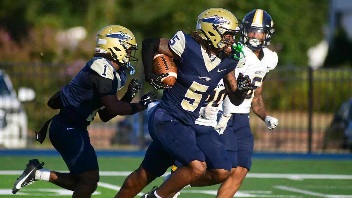 Michaell Pannell races to the end zone after catching pass from Javier Rice on the first play of NC Wesleyan's season opener vs. Averett.