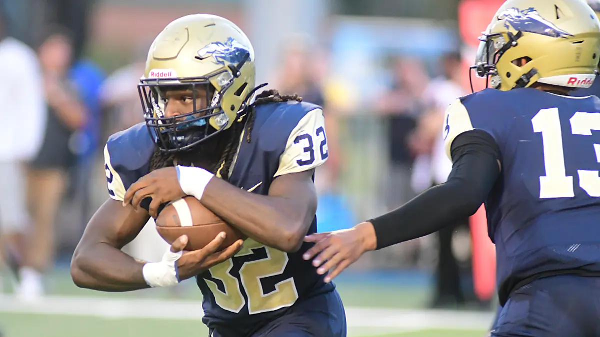 North Carolina Wesleyan running back Nahjiir Seagraves takes a handoff from Javier Rice in a game against Averett.