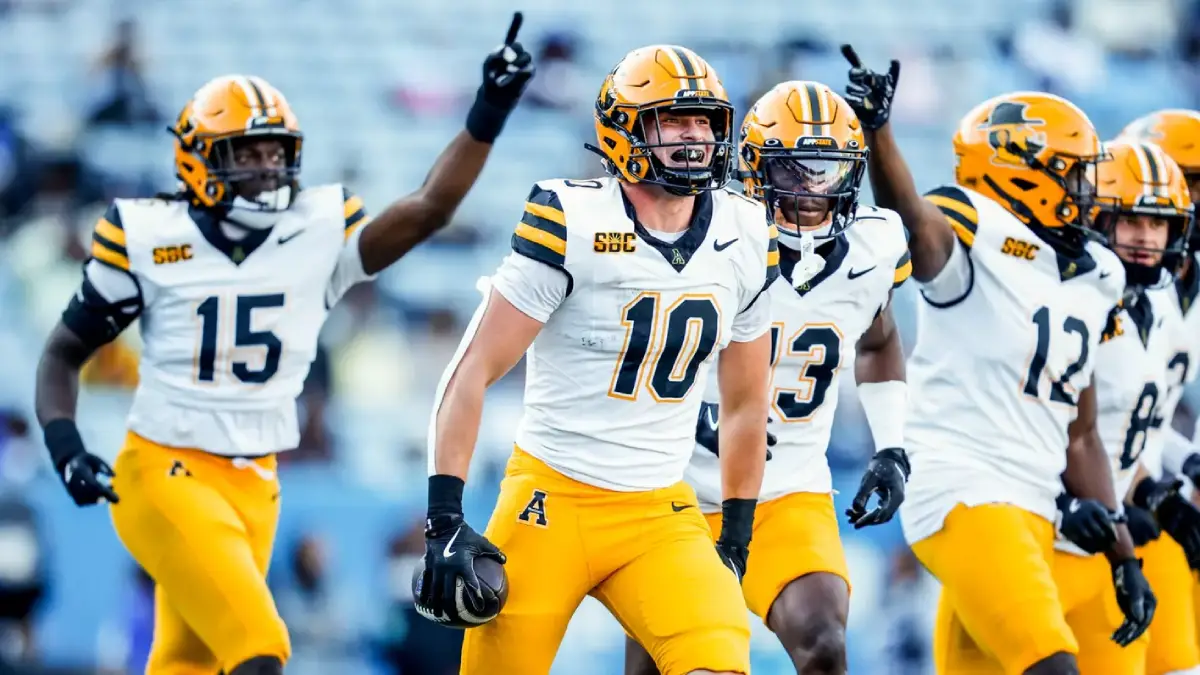 Appalachian State's Colton Phares (10) celebrates an interception with teammates against Georgia State.
