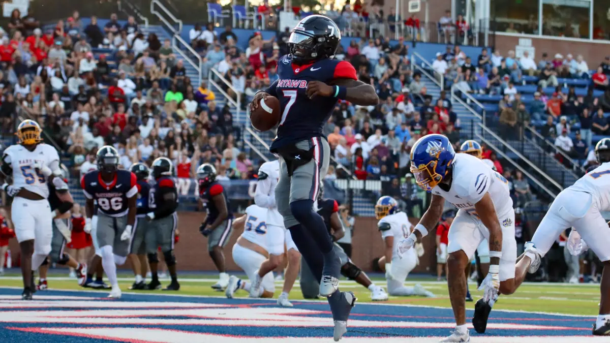 Catawba quarterback Preston Brown jaunts into the end zone against Mars Hill.