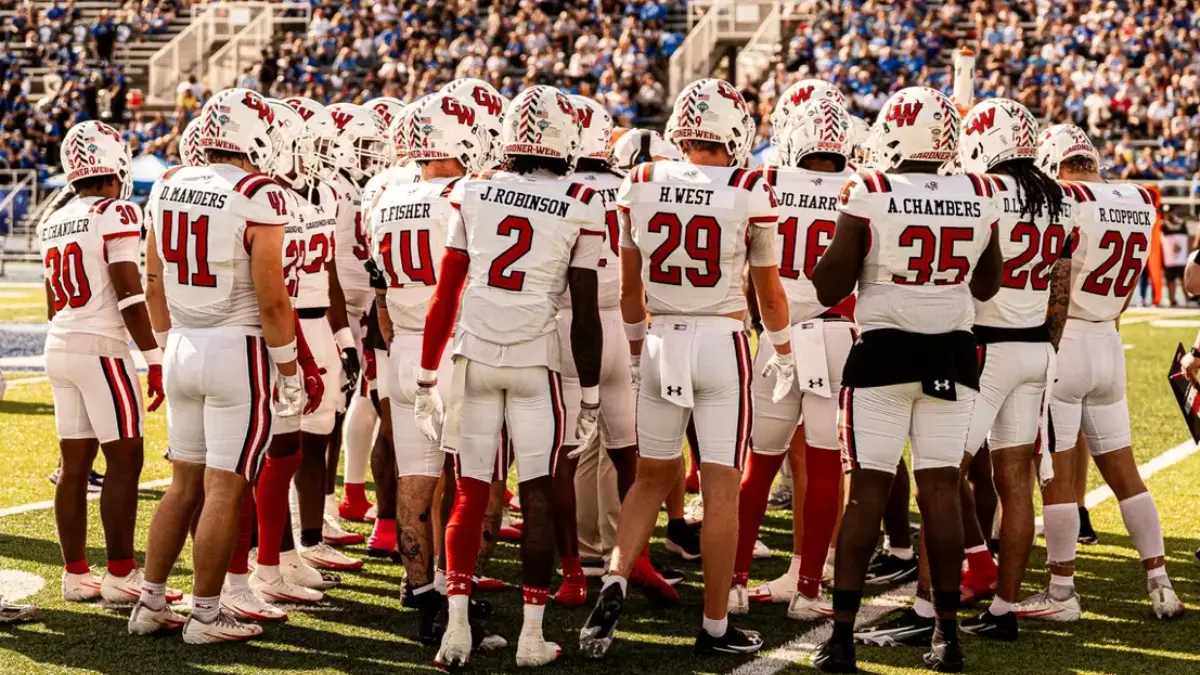 Gardner-Webb football players huddle up during a conference game at Eastern Illinois