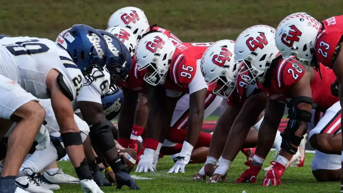 Gardner-Webb football offensive linemen get ready for a snap in a 2025 game.