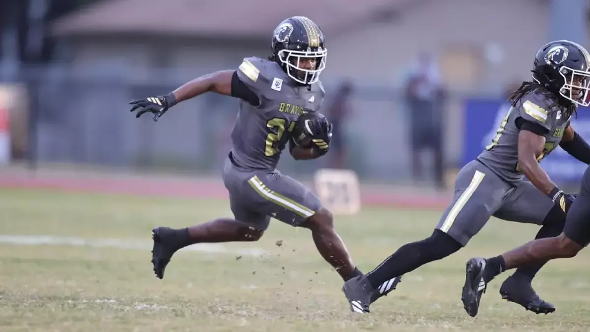 UNC Pembroke football runs the ball in open field