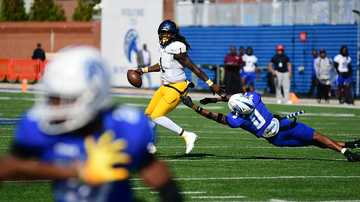 Johnson C. Smith quarterback Kelvin Durham eludes the rush against Fayetteville State