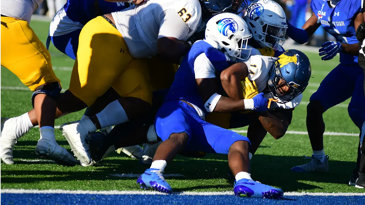 Johnson C. Smith running back Bobby Smith carries Fayetteville State tacklers with him into the end zone on the winning TD play in the fourth quarter.