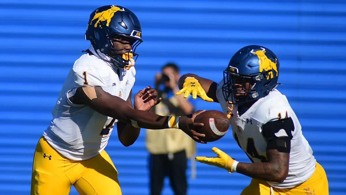 Johnson C. Smith quarterback Kelvin Durham hands off to Bobby Smith in a game against Fayetteville State.