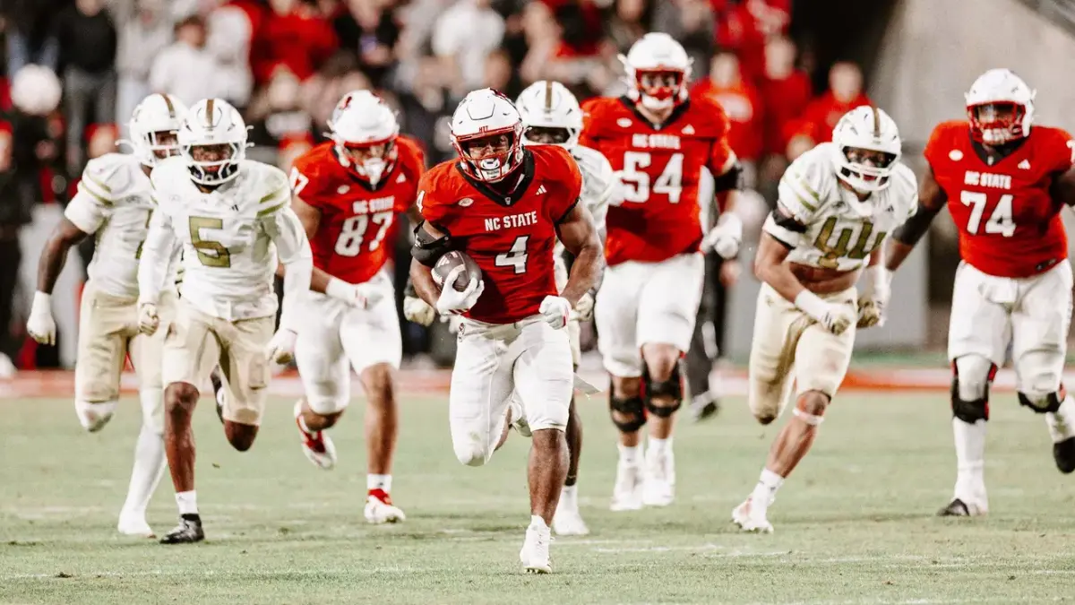 NC State running back Duke Scott racing away from the Georgia Tech defense on his way to a 69-yard gain.