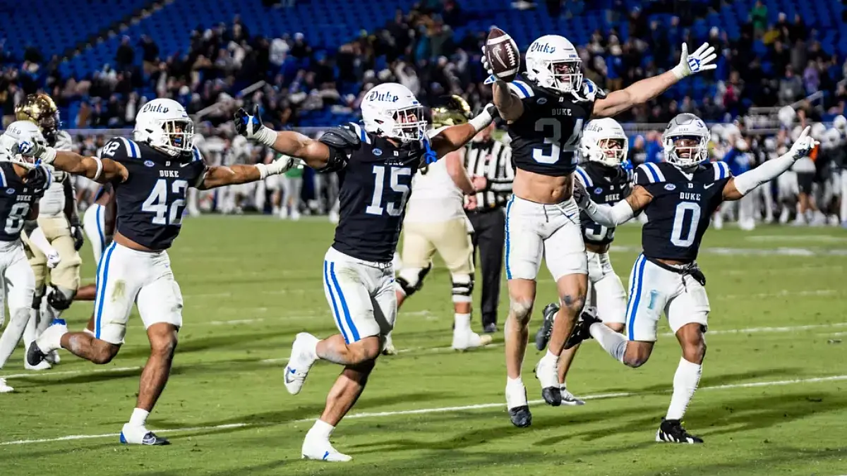 Duke football players celebrate a big game