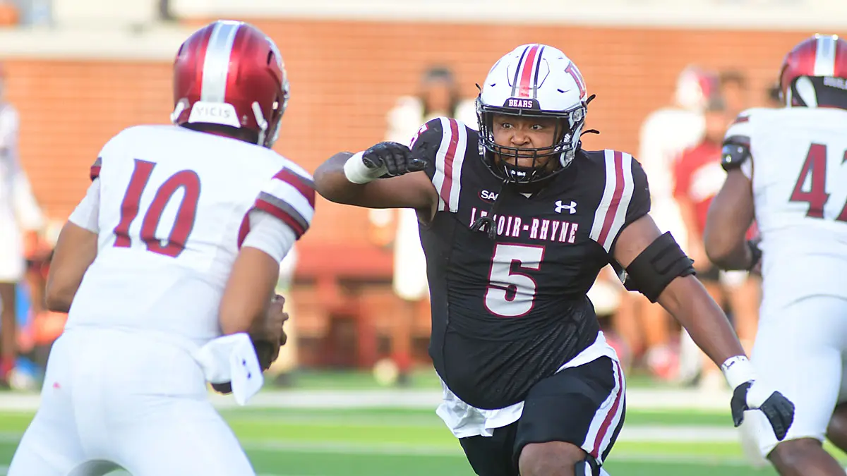 Lenoir-Rhyne defensive lineman Carnell Ferguson chases the VUU quarterback