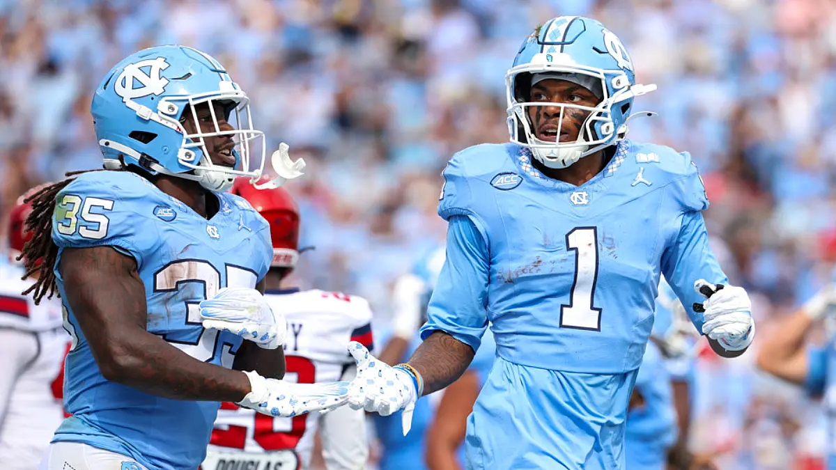 Wide receiver Jordan Shipp and running back Demon June of the North Carolina Tar Heels celebrate a touchdown during a game against the Richmond Spiders on September 13, 2025.