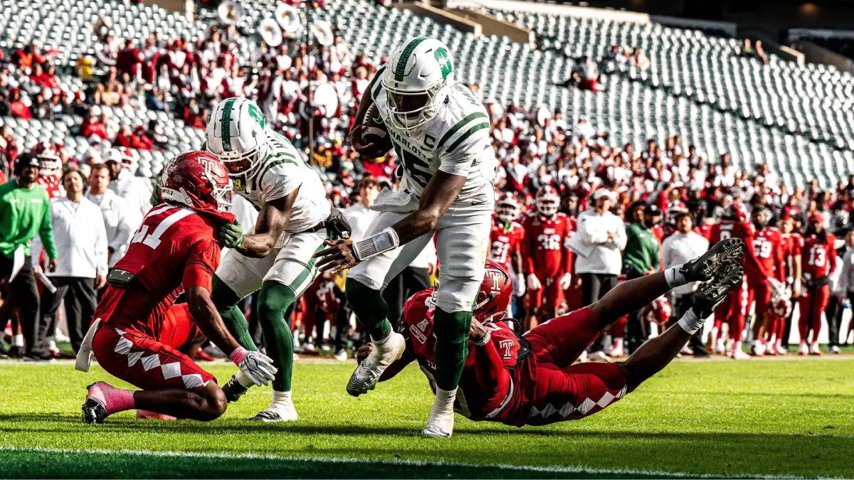 Connor Harrell carries the ball for the Charlotte 49ers against Temple.
