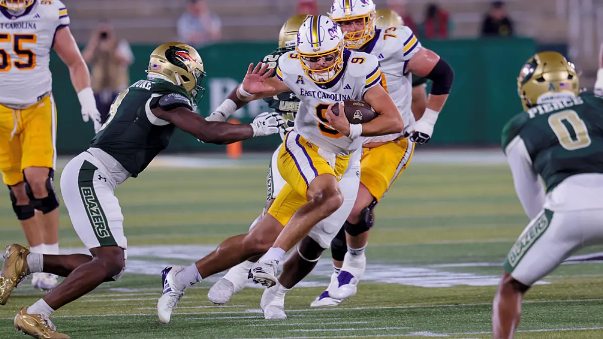 ECU quarterback Emory Williams avoids a would-be tackler in a game against UAB on Oct. 15, 2026.